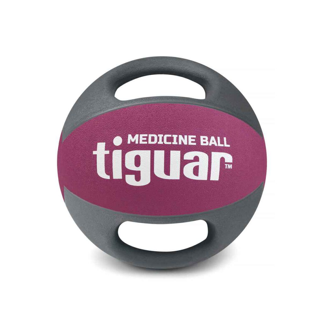 Ein lila und grau Tiguar Medizinball mit zwei eingebauten Griffen, mit der Aufschrift MEDICINE BALL tiguar auf der Vorderseite gedruckt. Der Ball ist vor einem weißen Hintergrund abgebildet.